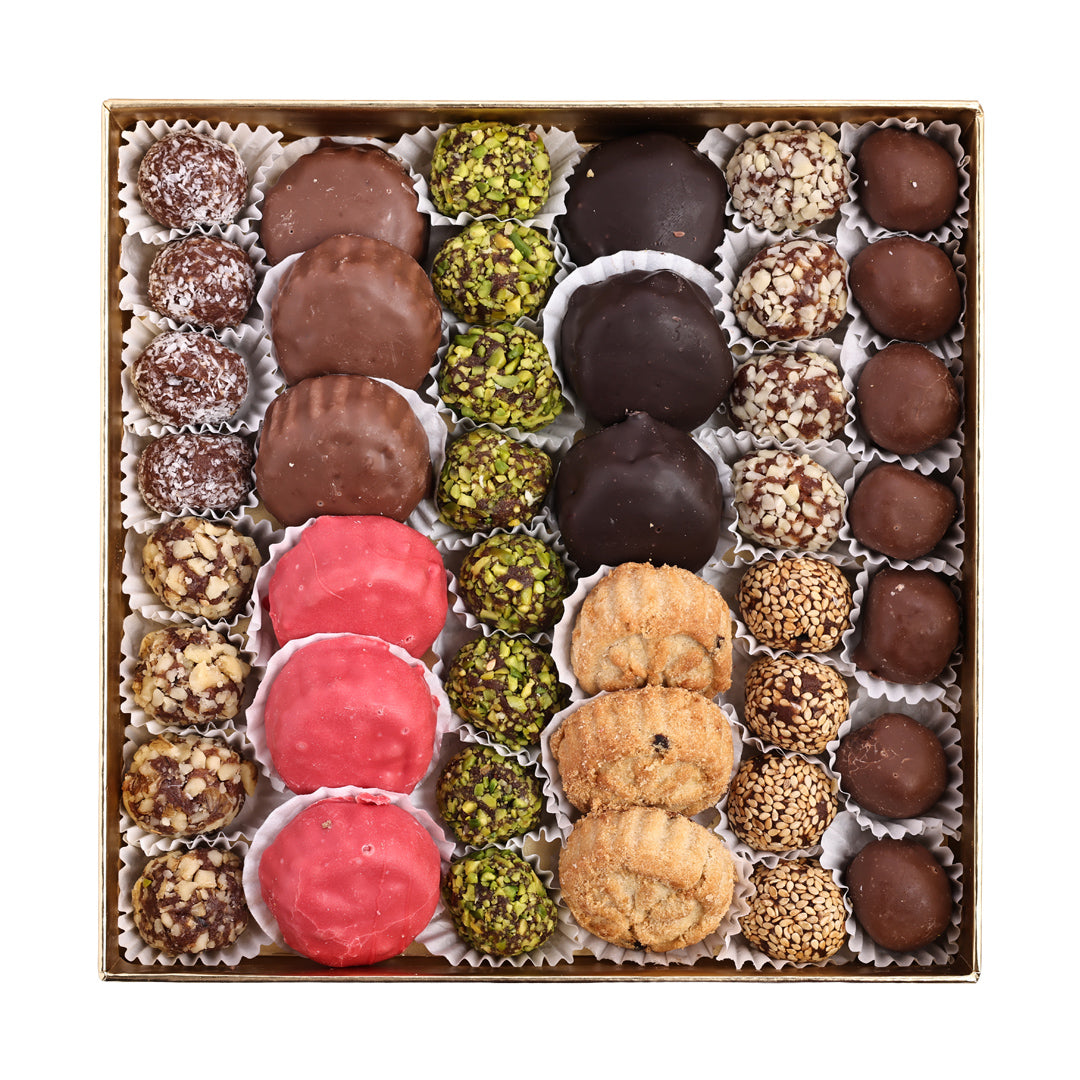 Assorted truffles in a box on a white background