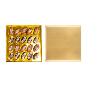 Golden Choco Gift box of chocolate-covered dates with nuts from kingdomdatesuae, showcasing glossy dates with nut toppings.