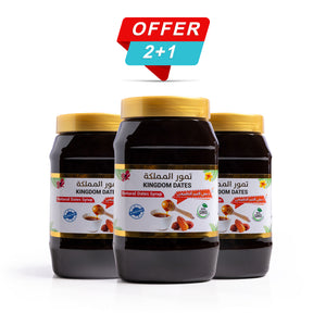 Bottle of Kingdom Dates UAE Natural Dates Syrup (Dibs) 1 KG with a clear label and dark syrup visible inside the bottle.