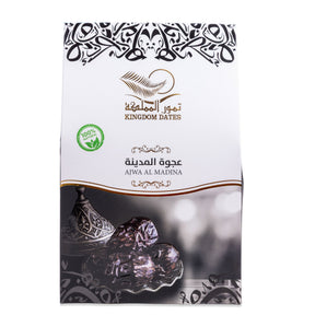 Ajwa Al Madina Dates displayed in a bowl, featuring dark, glossy dates with a smooth surface, from Kingdom Dates UAE.