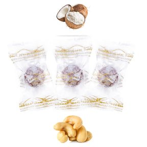 Coconut-wrapped dates protein ball with cashews by Kingdom Dates UAE, showing the snack's textured coconut coating and fresh ingredients.