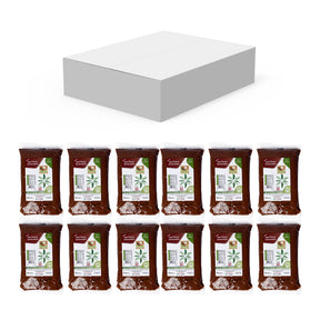 Premium dates paste from Kingdom Dates UAE in a 12 kg carton, showing a close-up of the rich, sticky date paste.