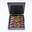 Majdoul dates with nuts in a sleek piano-finish carbon wooden gift box by Kingdom Dates UAE.