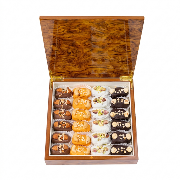 Assorted dates with nuts and signature chocolate in a desert sand wooden gift box from Kingdom Dates UAE.