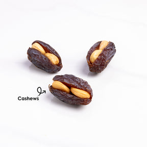 Premium stuffed dates with cashews from Kingdom Dates UAE, showing glossy Medjoul dates filled with whole cashews.