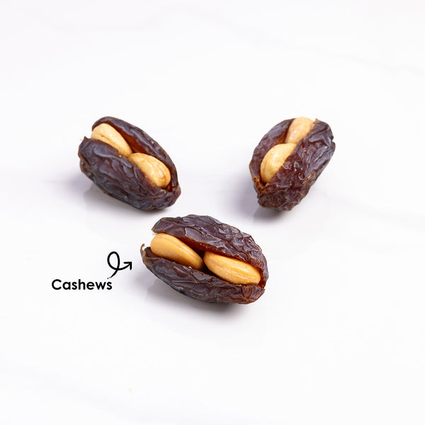 Premium stuffed dates with cashews from Kingdom Dates UAE, showing glossy Medjoul dates filled with whole cashews.
