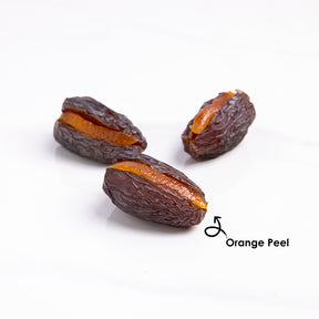 Premium stuffed dates with orange peel from Kingdom Dates UAE, featuring Medjoul dates filled with orange peel.