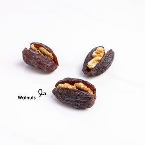 Premium stuffed dates with walnuts from Kingdom Dates UAE, showing close-up of Medjoul dates filled with walnuts.