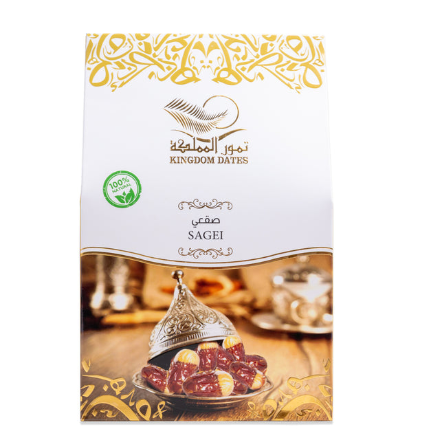 Fresh Sagi dates from Kingdom Dates UAE, showing their rich, plump appearance in a natural setting.