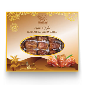 Fresh organic Sukkari Al Qasim dates from Kingdom Dates UAE displayed in a clear container on a white background.
