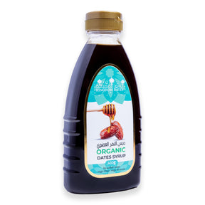 Organic dates syrup (Dibs) in a 400GM jar from Kingdom Dates UAE, showing the dark, thick syrup inside a clear glass jar.