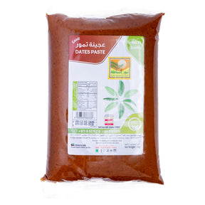 Premium Dates Paste from Kingdom Dates UAE, 1 kg jar showing rich, smooth, dark dates paste in a clear container.