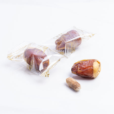 Wrapped Wadi Dates from Kingdom Dates UAE, showing plump, glossy dates in natural packaging.