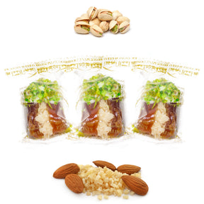 Wrapped pistachio chocolate dates from Kingdom Dates UAE with almonds, stuffed with nuts and dried fruits for a sweet treat.