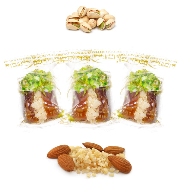 Wrapped pistachio chocolate dates from Kingdom Dates UAE with almonds, stuffed with nuts and dried fruits for a sweet treat.