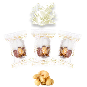 Wrapped vanilla chocolate dates stuffed with nuts and dried fruits, featuring white chocolate and cashews from Kingdom Dates UAE.