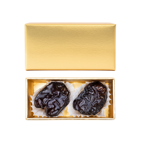 Golden Ajwa Madina gift box with premium dates from KingdomDatesUAE, featuring a decorative packaging and fresh dates inside.